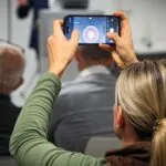 Someone holding up a phone