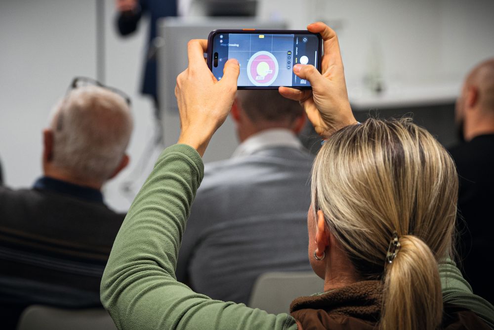 Someone holding up a phone